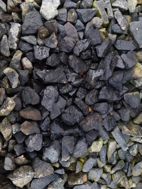 stone exposed to spilled factory waste oil