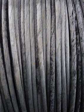 Power Aluminum Conductor on wooden table and Used in the construction of large power plants,Selective focus.Electric power aluminum conductor,Wire of electrical power cable.