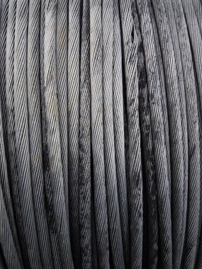 Power Aluminum Conductor on wooden table and Used in the construction of large power plants,Selective focus.Electric power aluminum conductor,Wire of electrical power cable.