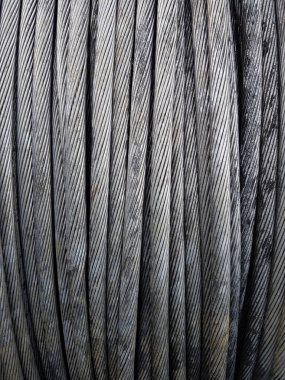 Power Aluminum Conductor on wooden table and Used in the construction of large power plants,Selective focus.Electric power aluminum conductor,Wire of electrical power cable.