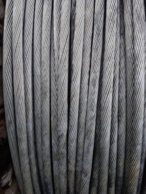 Power Aluminum Conductor on wooden table and Used in the construction of large power plants,Selective focus.Electric power aluminum conductor,Wire of electrical power cable.