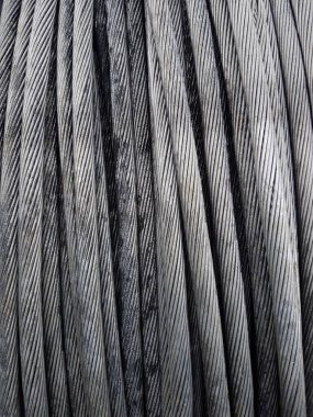 Power Aluminum Conductor on wooden table and Used in the construction of large power plants,Selective focus.Electric power aluminum conductor,Wire of electrical power cable.