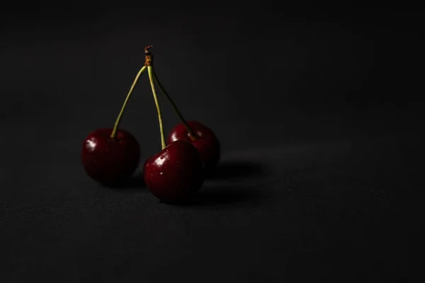 Three Cherries Placed Black Background Negative Space — Stock Photo, Image