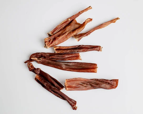 Natural dried treats for dogs. Treats for rewarding and training dogs. Dried meat products for dogs. Animal care.Selective focus. Advertisement for dog treats. bull penis.