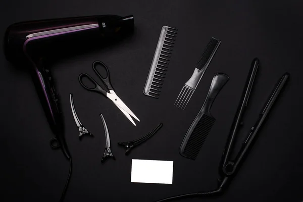 combs and hairdresser tools on black background top viewcombs and hairdresser tools on blue background top view