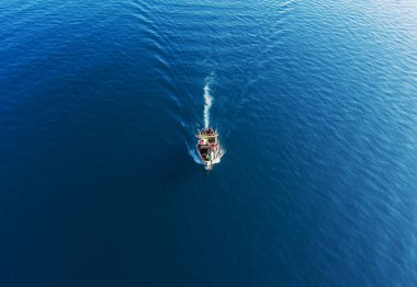 Boat making waves on lake