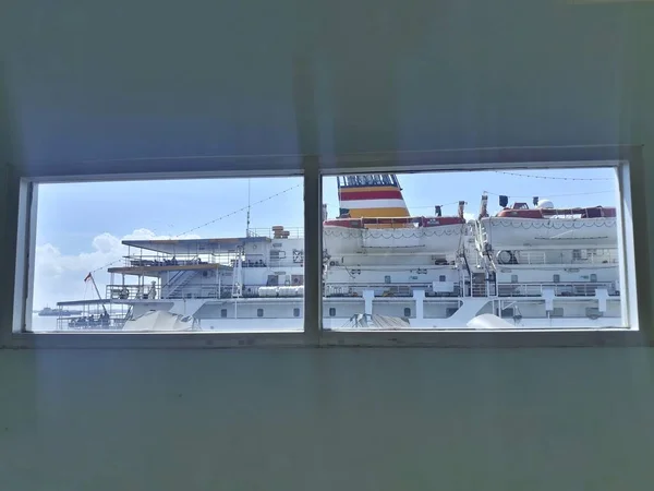Defocus looking through window to see the ship at the bright day at Tanjung Perak Port of Surabaya