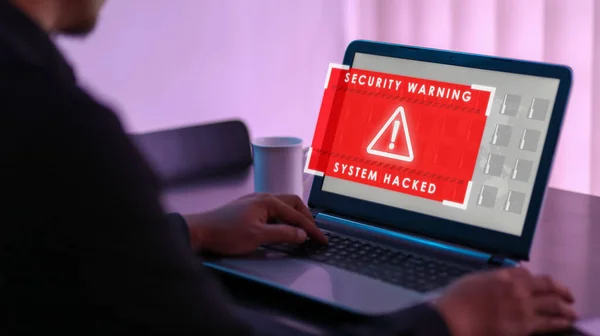 Virtual security warning system hacked alert on laptop screen. Cybersecurity vulnerability on internet, virus, data breach, malicious connection. Selective focus.