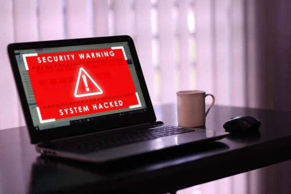 Virtual security warning system hacked alert on laptop screen. Cybersecurity vulnerability on internet, virus, data breach, malicious connection. Selective focus.