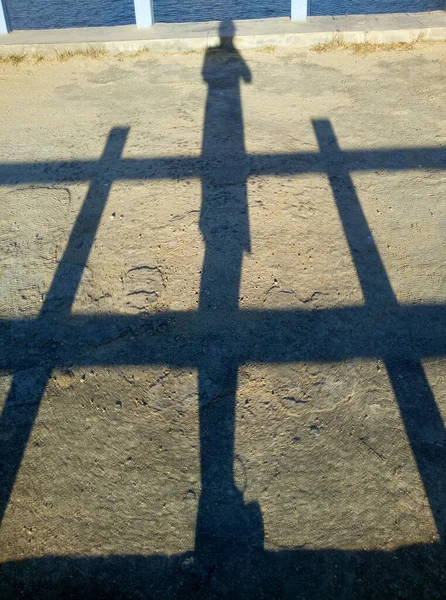 shadow of man on bridge background