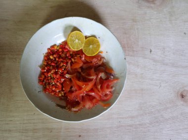 Sambal Dabu-dabu is traditional Minahasan Indonesian fresh salsa. Made of chopped chilli, tomato, shallot, lime or lemon. 