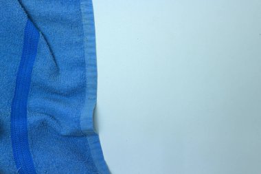 Top view of blue towel frame and white Background with copy space