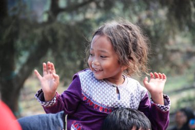 Dieng / Indonesia - August 1, 2015: Dieng Culture Festival, Tourists follow the dreadlocks procession during the Dieng Culture Festival event at Dieng, Banjarnegara district, Central Java