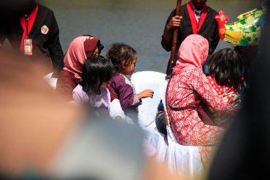 Dieng / Indonesia - August 1, 2015: Dieng Culture Festival, Tourists follow the dreadlocks procession during the Dieng Culture Festival event at Dieng, Banjarnegara district, Central Java