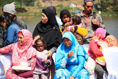 Dieng / Indonesia - August 1, 2015: Dieng Culture Festival, Tourists follow the dreadlocks procession during the Dieng Culture Festival event at Dieng, Banjarnegara district, Central Java
