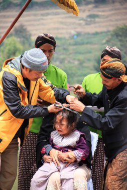 Dieng / Indonesia - August 1, 2015: Dieng Culture Festival, Tourists follow the dreadlocks procession during the Dieng Culture Festival event at Dieng, Banjarnegara district, Central Java