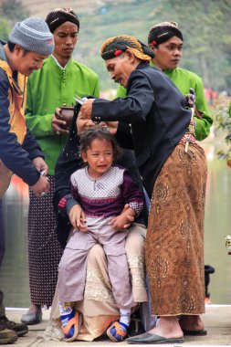 Dieng / Indonesia - August 1, 2015: Dieng Culture Festival, Tourists follow the dreadlocks procession during the Dieng Culture Festival event at Dieng, Banjarnegara district, Central Java