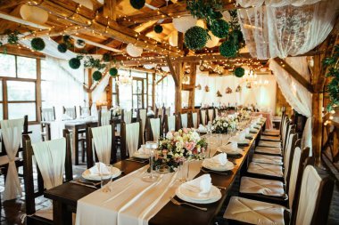 Rustic decorated indoors wedding venue.