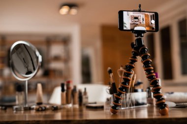 Smart phone on a tripod ready for vlog recording. 