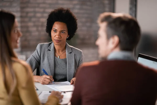 African American Bank Manager Talking Couple Filing Loan Application Meeting — ストック写真