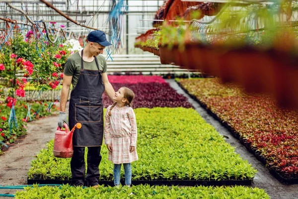 Young Happy Florist Watering Can Talking Little Girl Plant Nursery — Fotografia de Stock