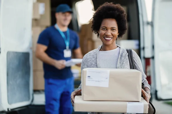 Portrait Happy Black Woman Getting Her Packages Delivered Looking Camera — Stock Fotó