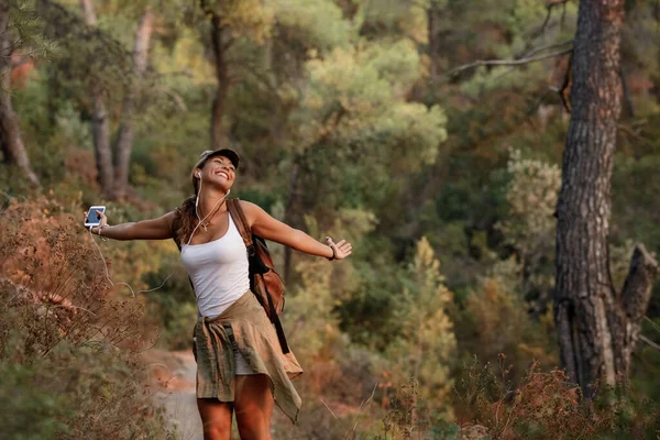 Carefree Woman Hiking Nature Listening Music Earphones — Stock Photo, Image
