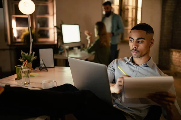 African American Entrepreneur Writing Reports While Working Late Computer Office — стоковое фото