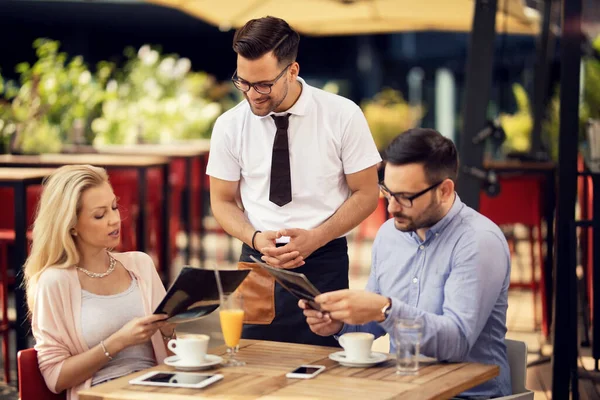 Couple Sitting Cafe Choosing Order Form Meu While Communicating Waiter — 스톡 사진