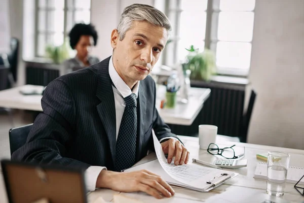 Portrait Mid Adult Businessman Sitting Desk Going Business Reports While — Stock Fotó