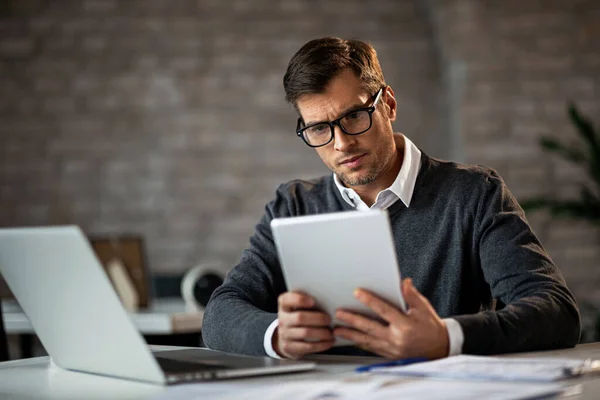 Mid Adult Entrepreneur Working His Office Desk Using Digital Tablet — Stock Fotó