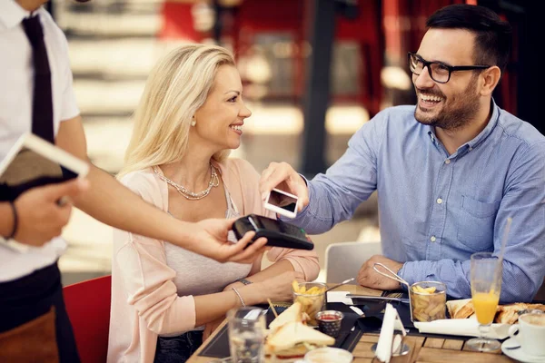 Happy Man Placing Smart Phone Credit Card Reader Making Contactless — Stockfoto