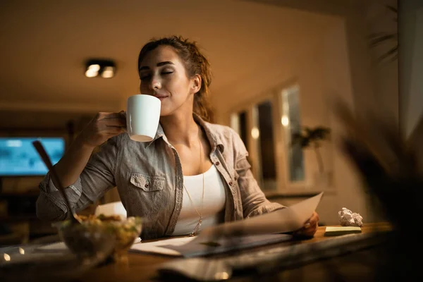 Female Student Eyes Closed Enjoying Smell Fresh Coffee While Learning —  Fotos de Stock