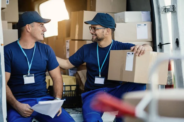 Young Happy Deliverers Communicating While Sitting Back Mini Van — Foto Stock