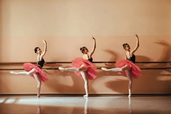 Full Length Happy Ballerinas Dancing While Holding Barre Ballet School — стоковое фото