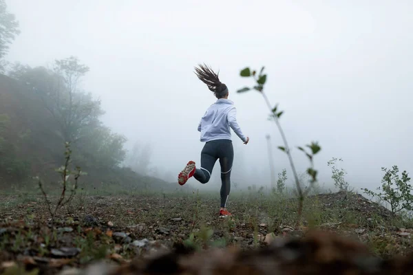 Low Angle View Motivated Sportswoman Running Nature Misty Weather Copy — Stock Fotó