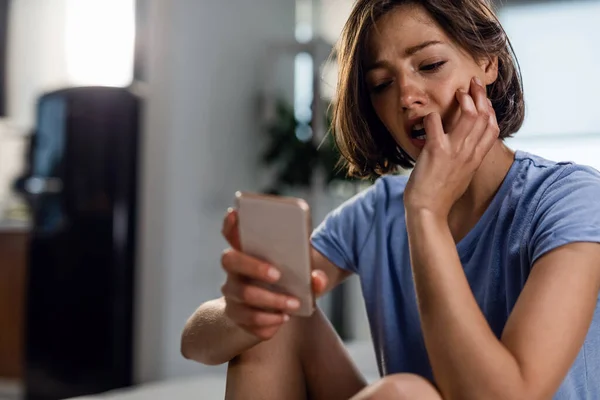 Young Sad Woman Thinking Something While Sitting Alone Bedroom Looking — Foto de Stock