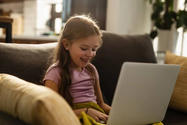 Happy Small Girl Relaxing Living Room Surfing Net Computer — Stockfoto