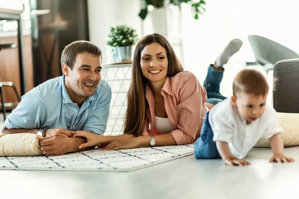 Happy Parents Enjoying While Watching Baby Boy Crawling Floor Living — Stockfoto