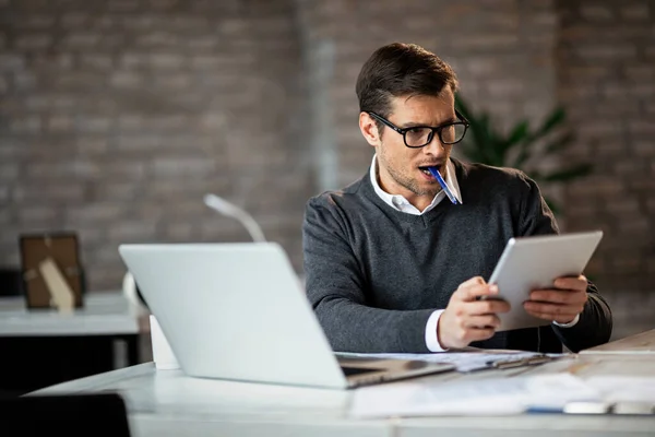 Businessman Reading Something Touchpad While Having Busy Day Office — Stock Fotó