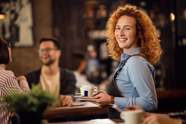 Happy Redhead Waitress Working Cafe Serving Guests Coffee While Looking —  Fotos de Stock