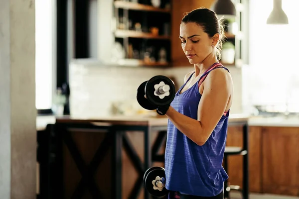 Young Female Athlete Having Sports Training Home Lifting Weights — 图库照片