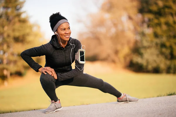 Happy Black Athletic Woman Stretching While Working Out Nature — Stock Fotó