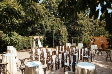 Decorated wedding aisle for marriage ceremony in a garden. 