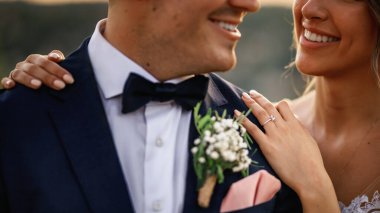Close-up of happy bride and groom on their wedding day. 
