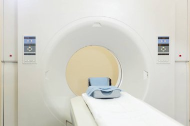 Magnetic resonance imaging machine with no people in medical examination room. 
