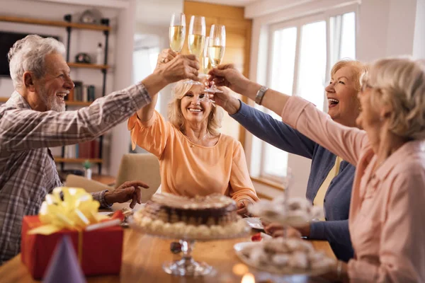 Group Happy Mature People Having Fun While Toasting Champagne Birthday — стоковое фото