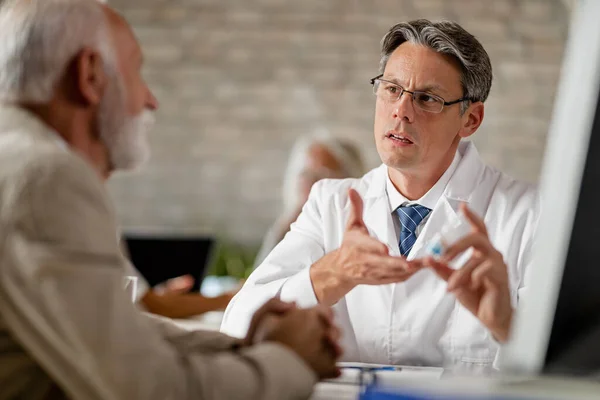 Male Doctor Explaining Mature Patient How Take Prescription Medicine Counselling — ストック写真