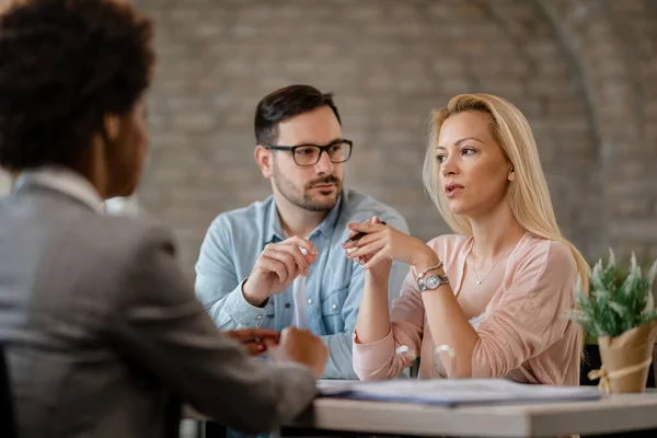 Mid Adult Couple Talking Financial Advisor Meeting Office Focus Pensive — Stockfoto