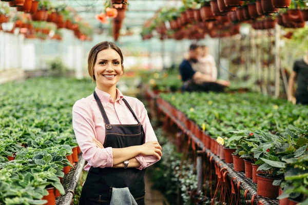 Happy Female Florist Standing Arms Crossed Looking Camera Plant Nursery — Fotografia de Stock